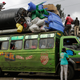 Travelers going to their rural homes wait inside minibuses as they wait for their belongings to be tied on top of the buses at one of the busy bus stations in downtown Nairobi, Kenya, 03 August 2017. For the past few days most of the bus stops in Nairobi have been busy as most Kenyans residing in the capital continue to flock them, as they travel to their upcountry homes ahead of polls to vote and some leaving the city as a security measure fearing violence might break after the elections. Kenya will hold general elections on 08 August.
